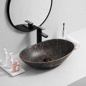 Lavabo Higueras — Lavabo oval efecto mármol negro con vetas doradas.